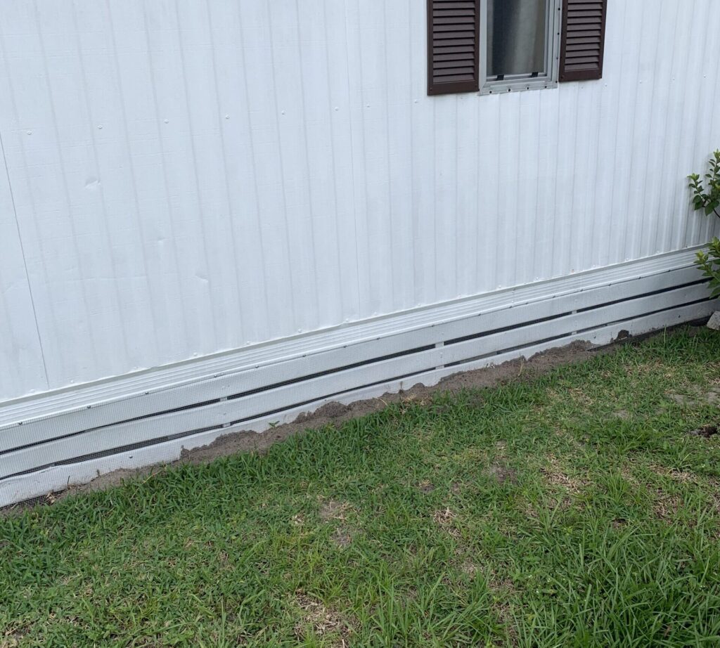 Odessa Florida mobile home sealed with ¼-inch hardware cloth buried 8 inches deep for rodent and wildlife exclusion.