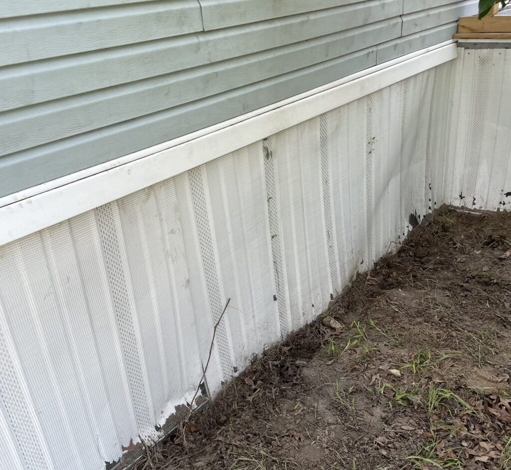 Completed Dover mobile home wildlife exclusion using secure hardware cloth barriers