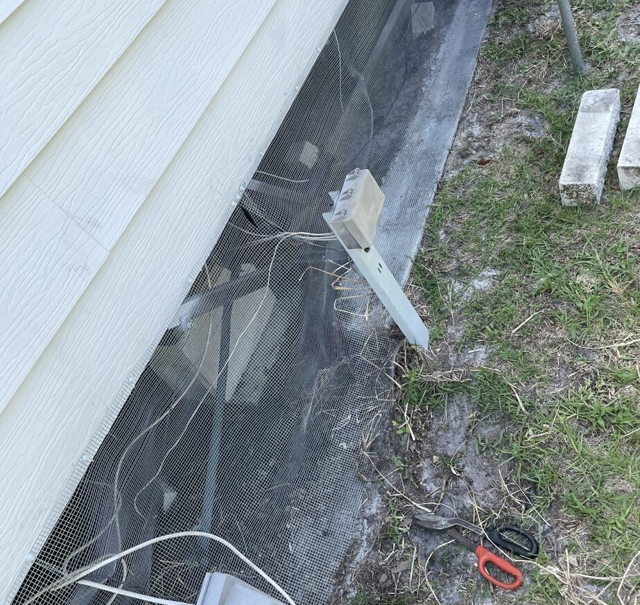 Beacon Square mobile home with hardware cloth barrier tap‑conned into concrete foundation, attic and soffit screened, optional internal wrap for discreet wildlife exclusion.