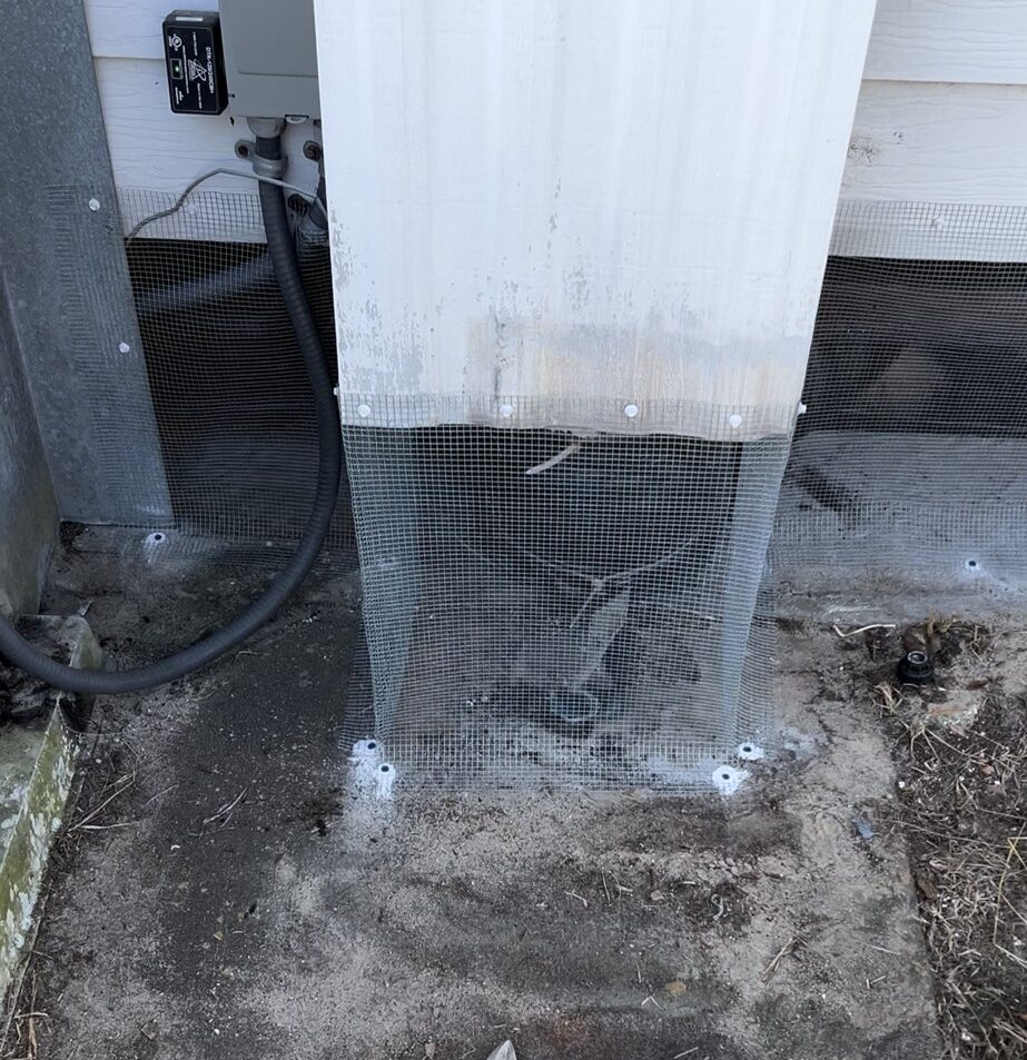 Crystal Springs mobile home featuring hardware cloth barrier (buried or concrete-mounted), soffit and attic vent sealing, with optional hidden interior wrap for discreet wildlife protection.