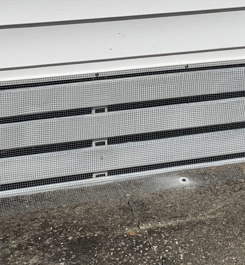 Completed wildlife exclusion installation beneath a Ruskin mobile home with secure hardware cloth barriers